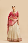 IVORY BANARSI BOOTI LEHENGA WITH FUSCHIA CHOLI AND DUPATTA