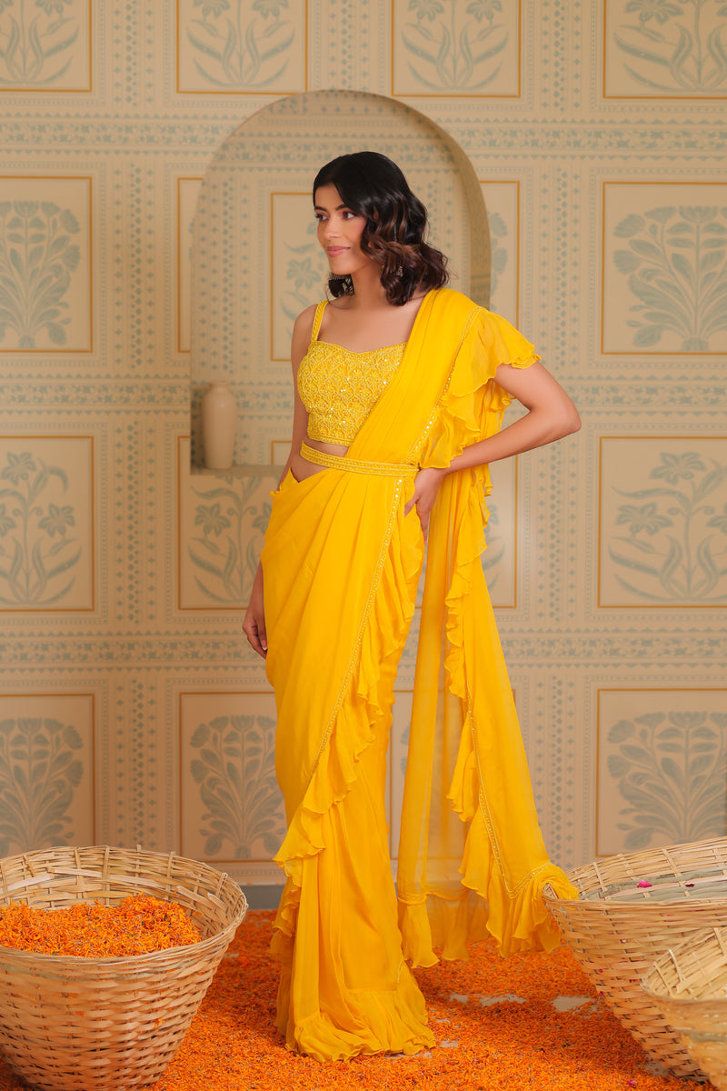 Yellow drape saree with blouse and belt