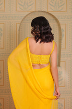 Yellow drape saree with blouse and belt