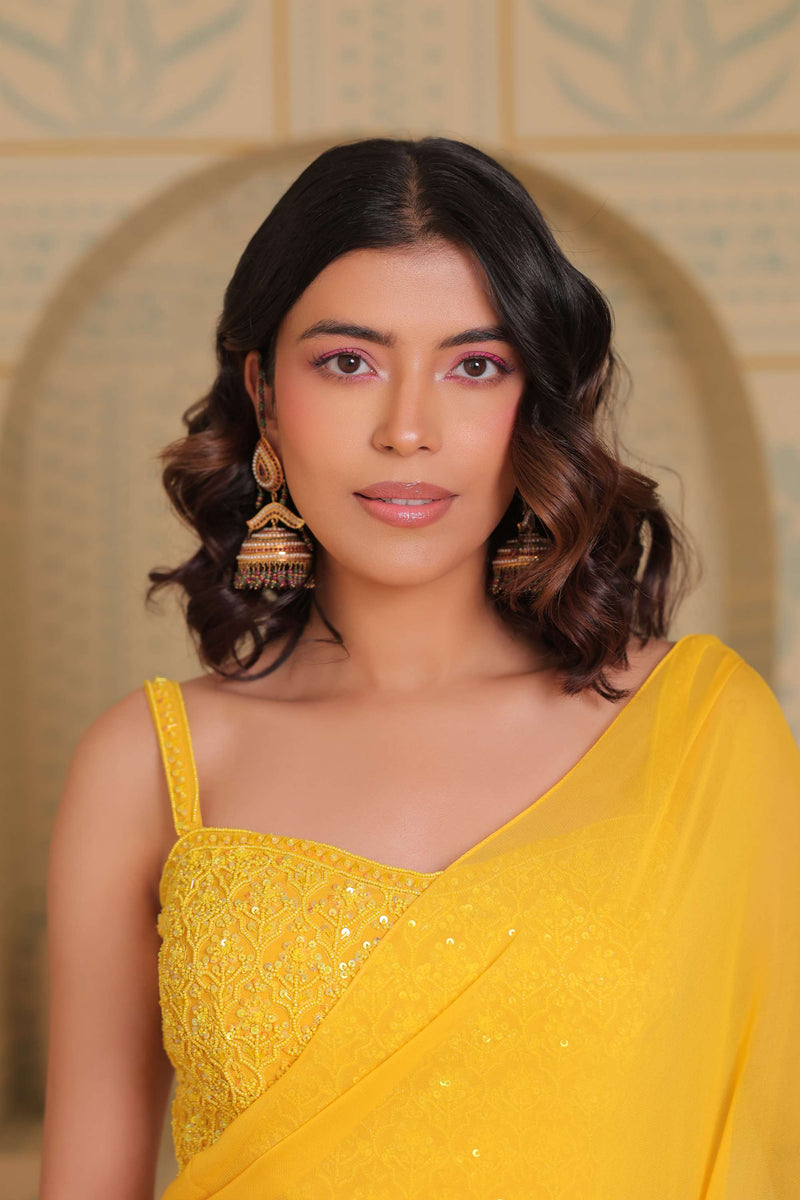 Yellow drape saree with blouse and belt