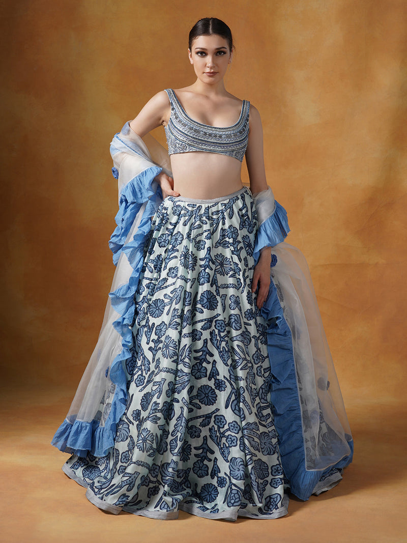 A Printed Lehenga Set With Intricately Embroidered Blouse And Organza Dupatta With Cotton Frill Border