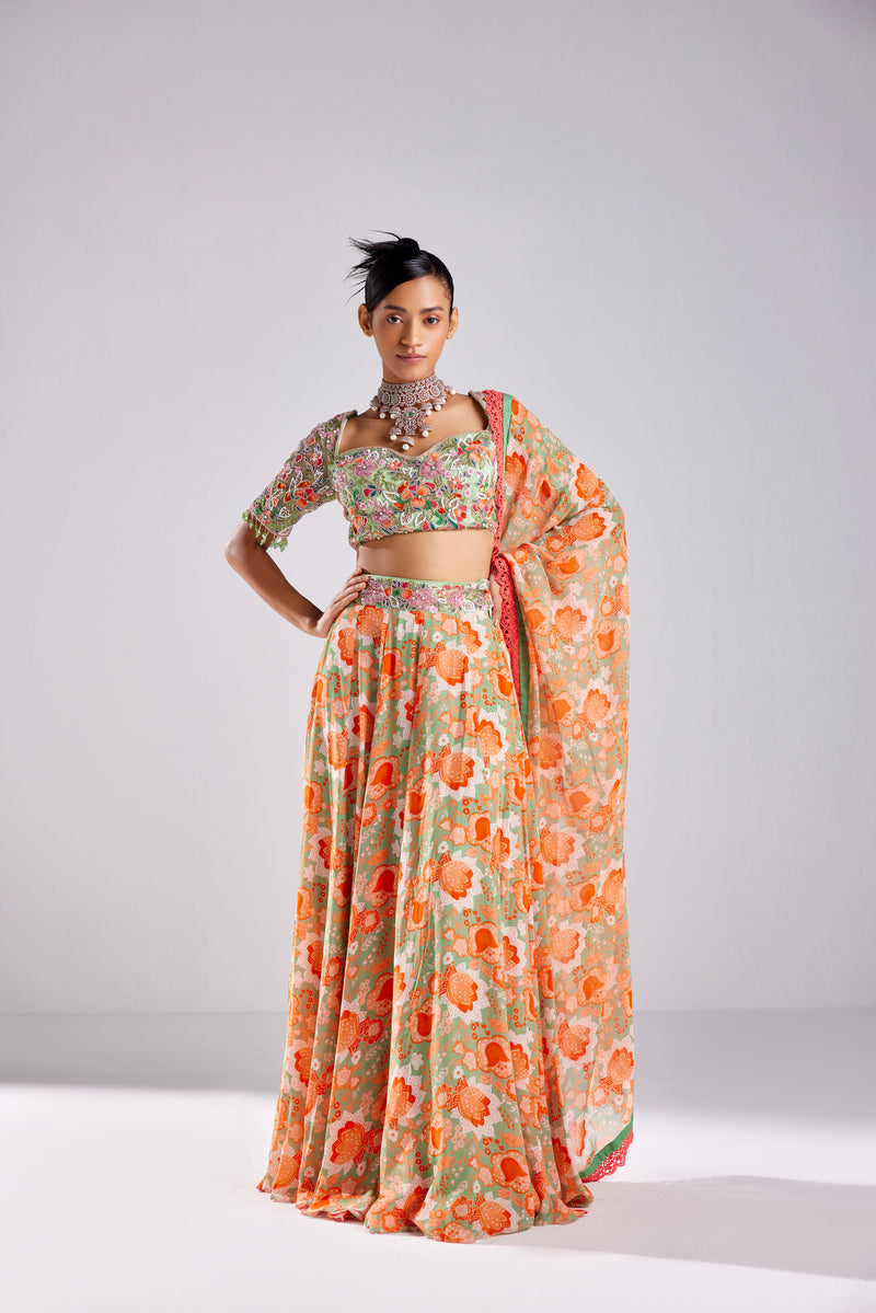 MINT GREEN FLORAL MIX MATERIAL EMBROIDERED TASSEL DETAILED BLOUSE WITHBEMBROIDERED BELT DETAILED MINT GREEN FLORAL JAAL PRINTED SKIRT AND DUPATTA