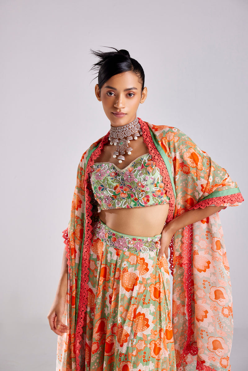 MINT GREEN FLORAL MIX MATERIAL EMBROIDERED TASSEL DETAILED BLOUSE WITHBEMBROIDERED BELT DETAILED MINT GREEN FLORAL JAAL PRINTED SKIRT AND DUPATTA