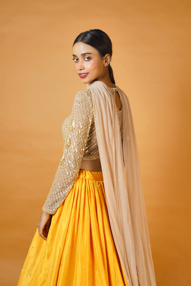 Gold blouse and dupatta with fire yellow lehenga