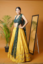 Green blouse and dupatta with mustard lehenga