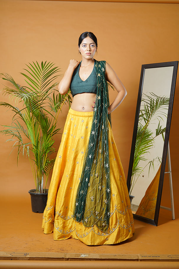 Green blouse and dupatta with mustard lehenga