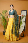 Green blouse and dupatta with mustard lehenga