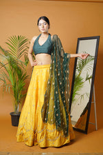 Green blouse and dupatta with mustard lehenga