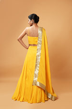 BRIGHT YELLOW COLOURED SLEEVELESS LEHENGA.