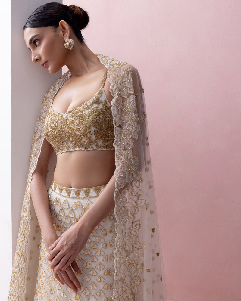 IVORY AND GOLD FISHTAIL LEHENGA SET WITH ORGANZA APPLIQUE AND CRYSTALS