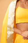 BRIGHT YELLOW COLOURED SLEEVELESS LEHENGA.