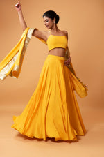 BRIGHT YELLOW COLOURED SLEEVELESS LEHENGA.