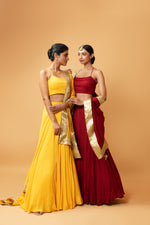 DEEP RED COLOURED SLEEVELESS LEHENGA.