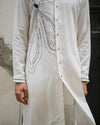 White Bloom KurtaFeaturing our White Bloom Kurta set on a crepe base with an abstract handpainted and hand-embroidered flower at the front. Paired with matching trousers to complete the look.
