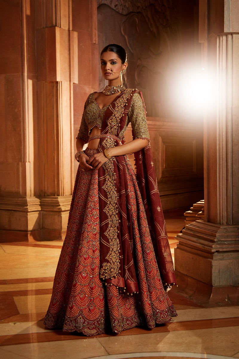 RUST TAFETTA LEHENGA WITH OLIVE CHOLI, MAROON TISSUE DUPATTA AND BELT