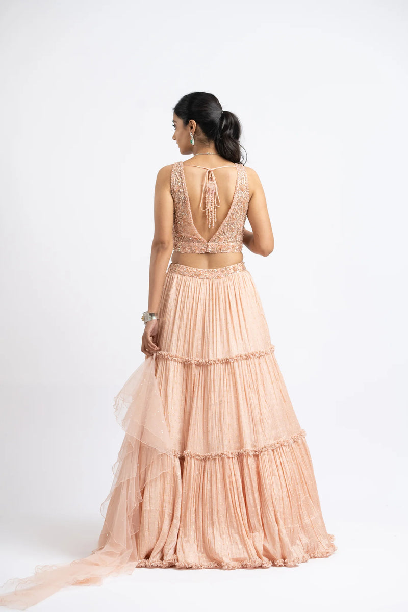 PEACH CRUSHED CHIGNON TIERED LEHENGA