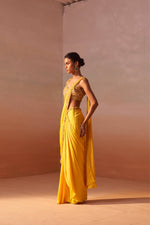 YELLOW DRAPED SAREE WITH NUDE CHOLI