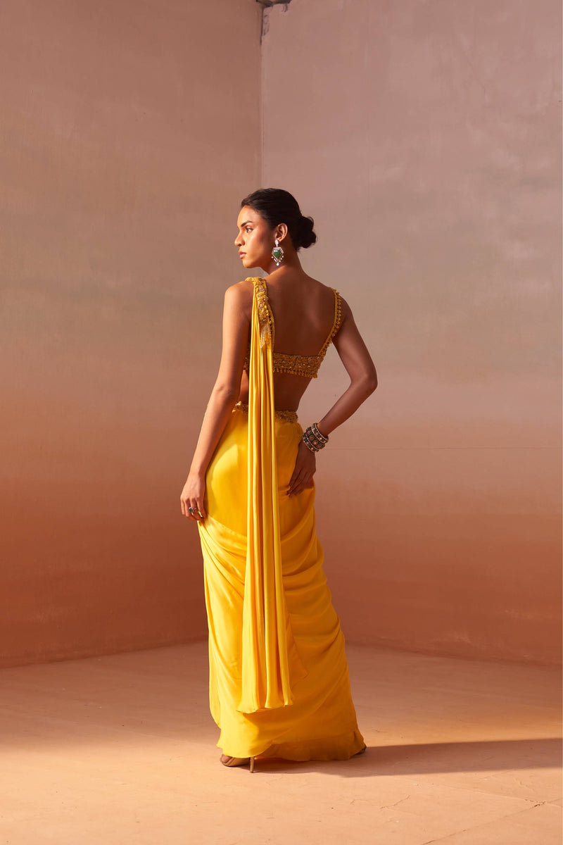 YELLOW DRAPED SAREE WITH NUDE CHOLI