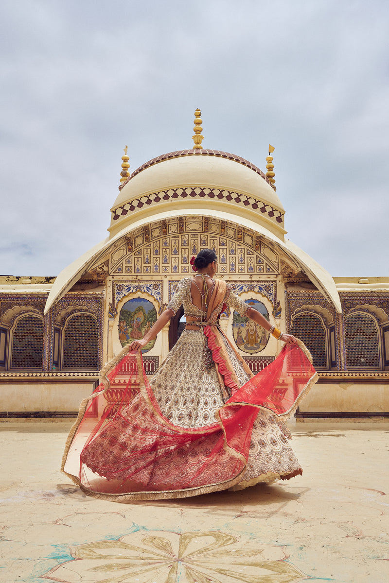 GOLD TISSUE LEHENGA CHOLI WITH A PEACH  TISSUE  DUPATTA