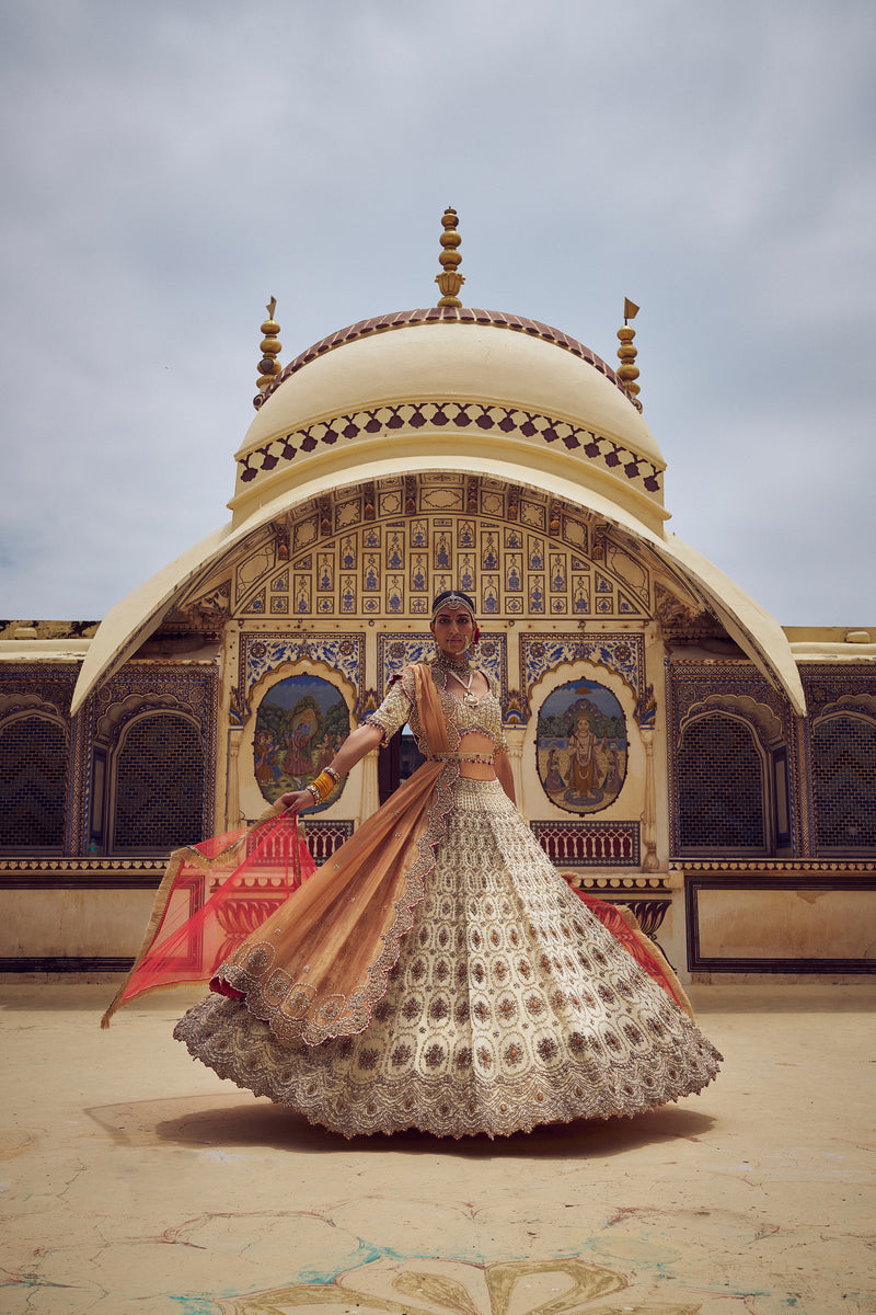 GOLD TISSUE LEHENGA CHOLI WITH A PEACH  TISSUE  DUPATTA