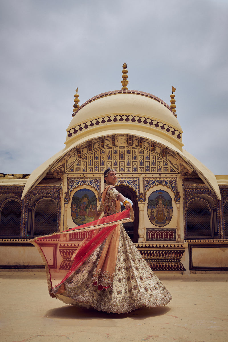 GOLD TISSUE LEHENGA CHOLI WITH A PEACH  TISSUE  DUPATTA