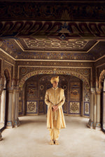 GOLD RAW SILK SHORT SHERWANI WITH A SATIN KURTA AND DHOTI