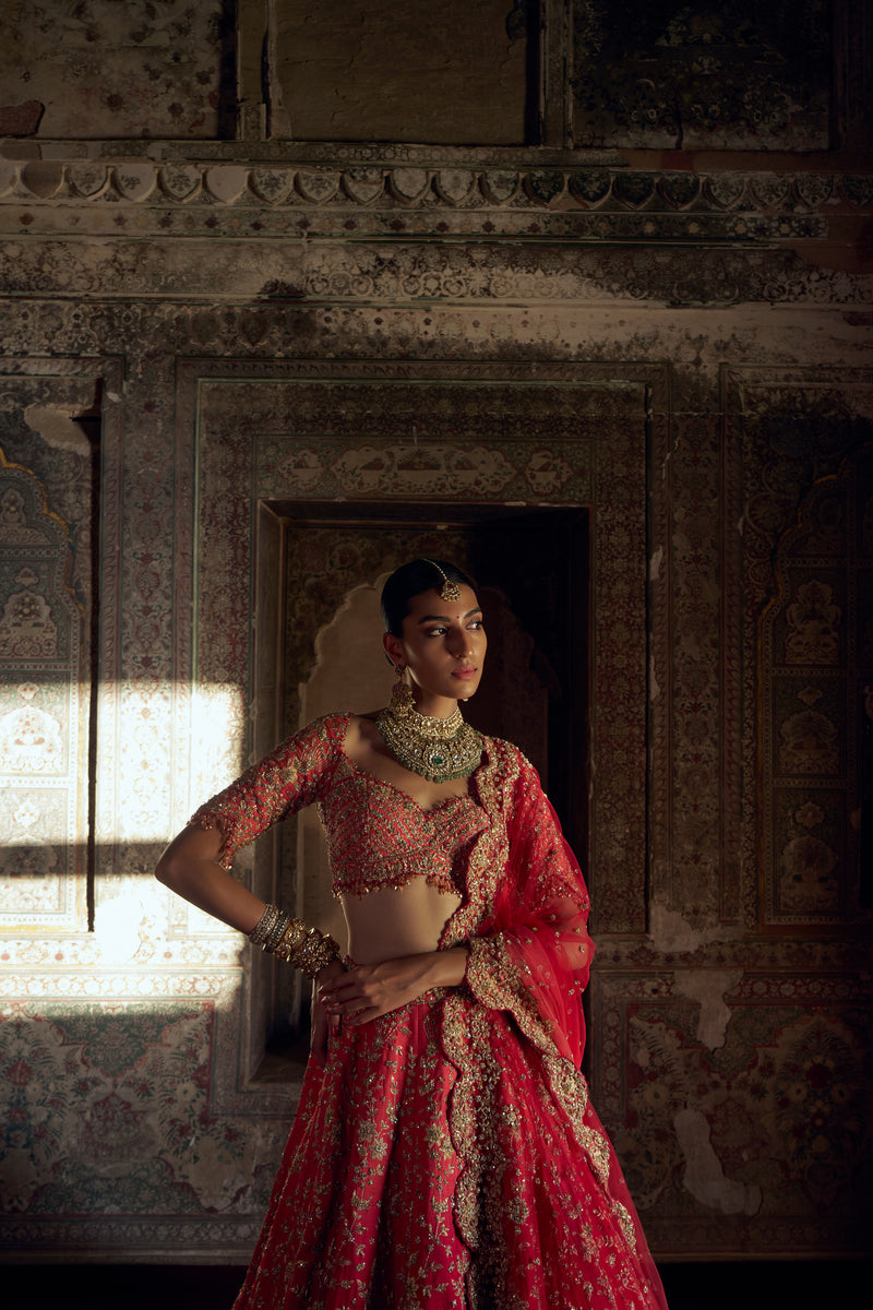 RED TO CORAL OMBRE DYED RAW SILK LEHENGA WITH A CORAL CHOLI