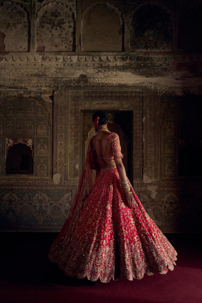 RED TO CORAL OMBRE DYED RAW SILK LEHENGA WITH A CORAL CHOLI