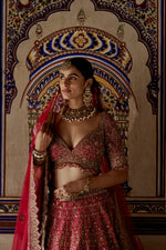 RED RAW SILK LEHENGA CHOLI WITH A NET DUPATTA