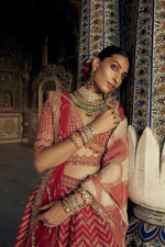 RED RAW SILK LEHENGA CHOLI WITH A NET DUPATTA