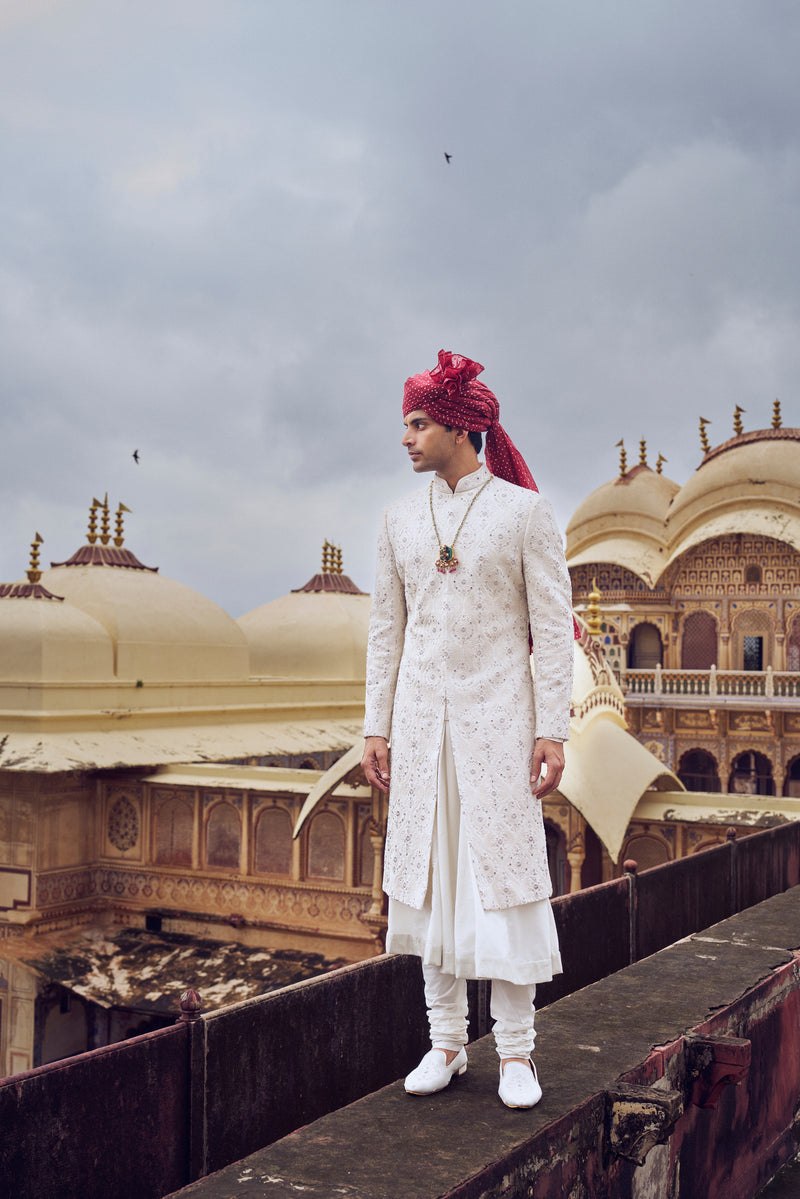 IVORY RAW SILK SHERWANI WITH A COTTON SILK CHOGA AND CHURIDAR