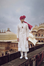 IVORY RAW SILK SHERWANI WITH A COTTON SILK CHOGA AND CHURIDAR