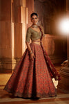 RUST TAFETTA LEHENGA WITH OLIVE CHOLI, MAROON TISSUE DUPATTA AND BELT