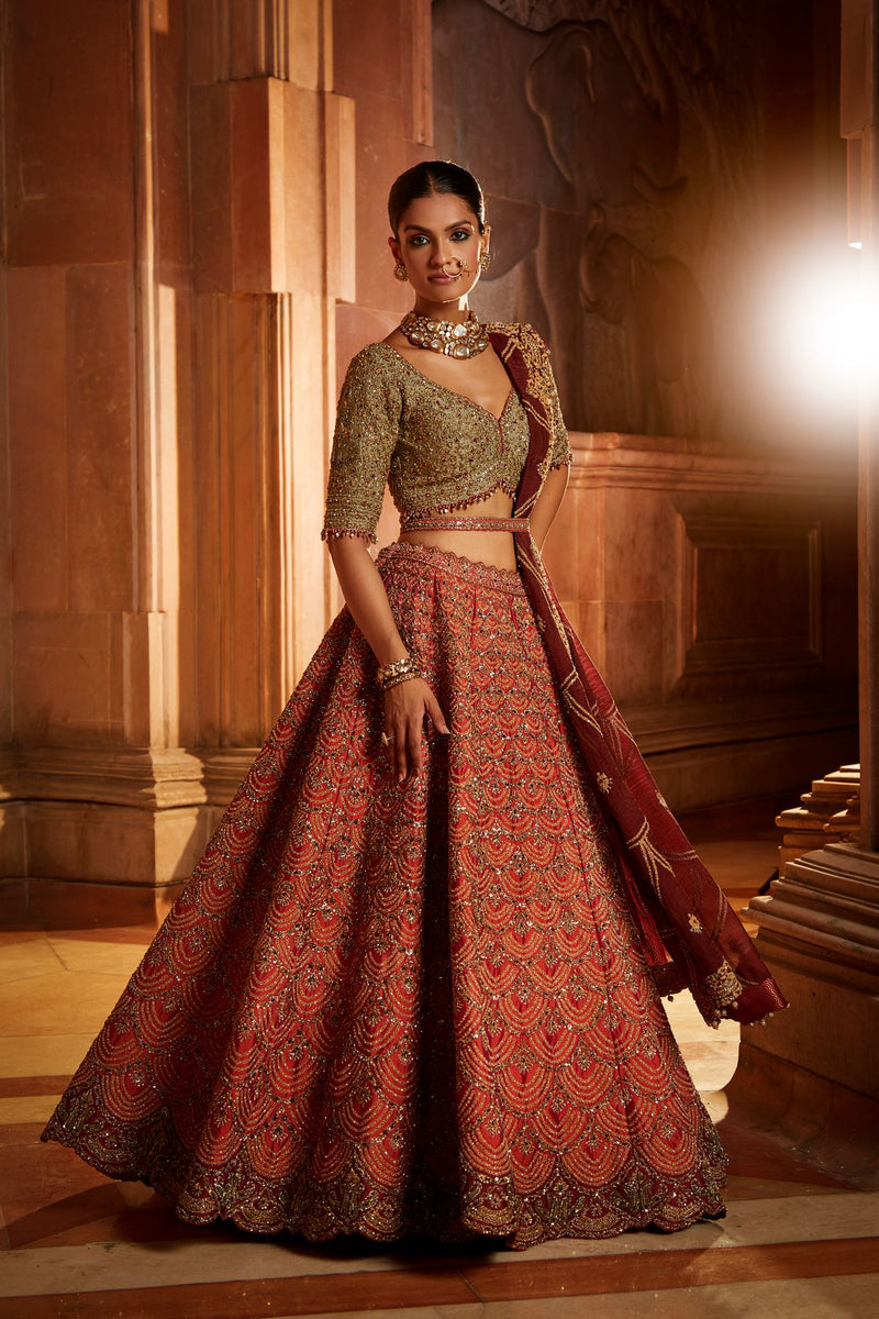 RUST TAFETTA LEHENGA WITH OLIVE CHOLI, MAROON TISSUE DUPATTA AND BELT