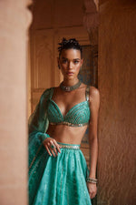 An Aqua Green Organza Lehenga with dupatta