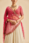 IVORY BANARSI BOOTI LEHENGA WITH FUSCHIA CHOLI AND DUPATTA