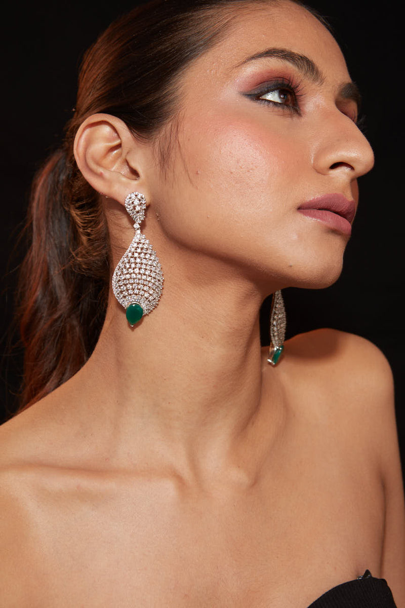 Rhodium Plated Zircon Studded With Green Synthetic Emerald Stone Dangle Earrings