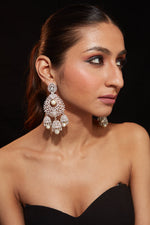 Rhodium Plated Zircon Studded With Pearl Drop Jhumka Dangle Earrings