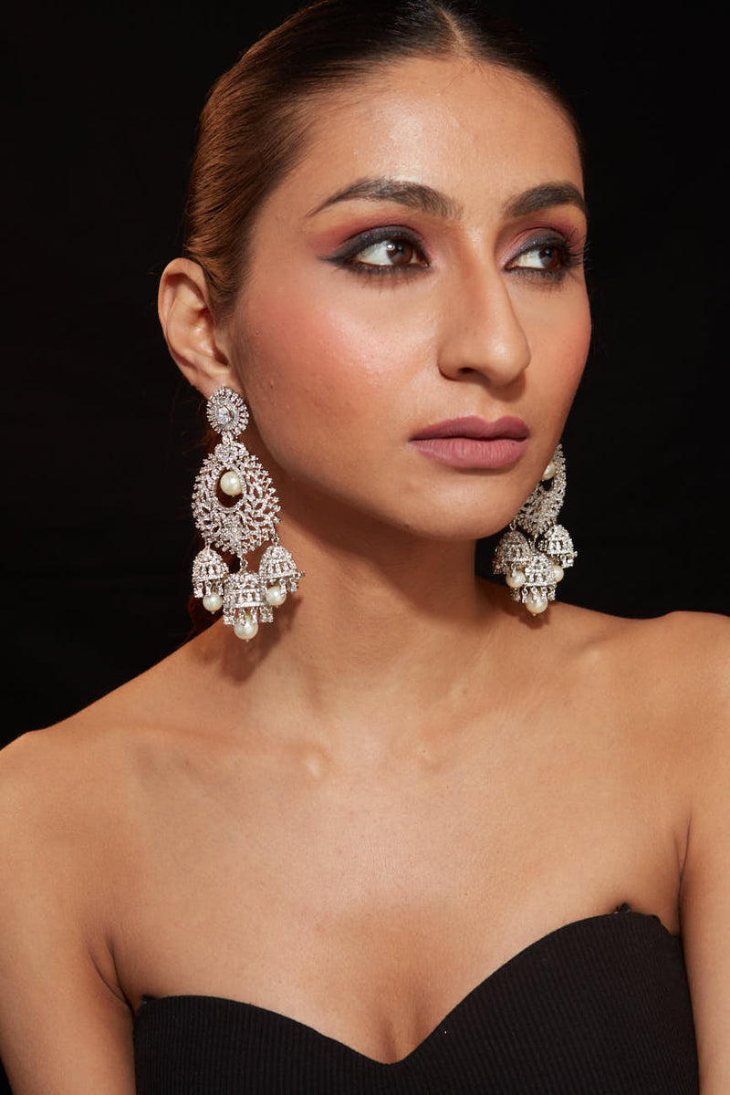 Rhodium Plated Zircon Studded With Pearl Drop Jhumka Dangle Earrings