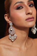 Rhodium Plated Zircon Studded With Pearl Drop Jhumka Dangle Earrings