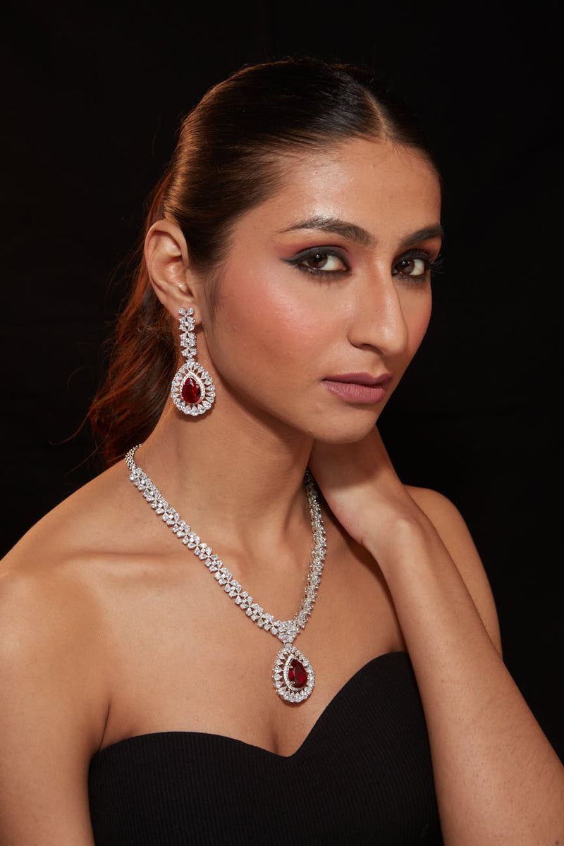 Rhodium Plated Zircon Studded With Red Synthetic Stone Pendant Necklace & Drop Earrings Set