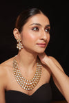 Gold Plated Kundan Studded Multi Layered Necklace & Dangle Earrings Set