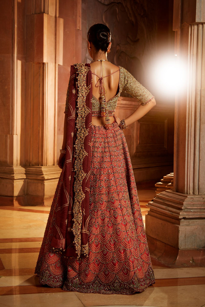 RUST TAFETTA LEHENGA WITH OLIVE CHOLI, MAROON TISSUE DUPATTA AND BELT