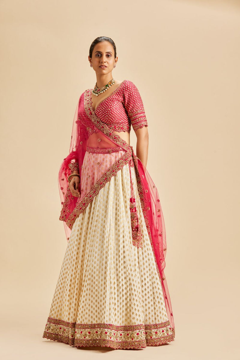 IVORY BANARSI BOOTI LEHENGA WITH FUSCHIA CHOLI AND DUPATTA