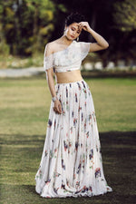 One off-shoulder Ivory lehenga set