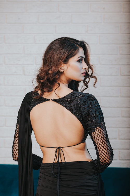 Black draped saree with embroidered blouse