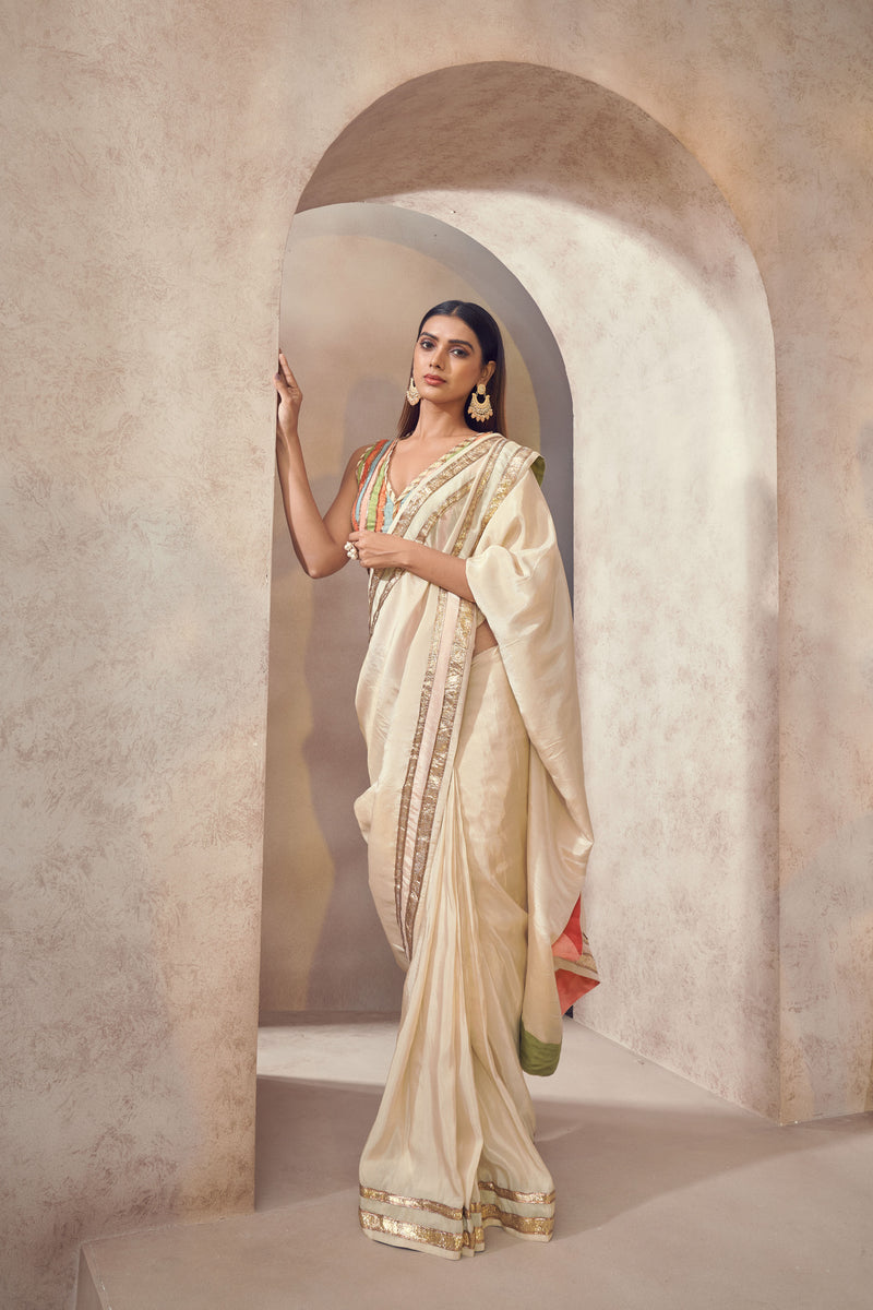 Sunehri Tissue silk saree with multicolored blouse