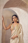 Sunehri Tissue silk saree with multicolored blouse