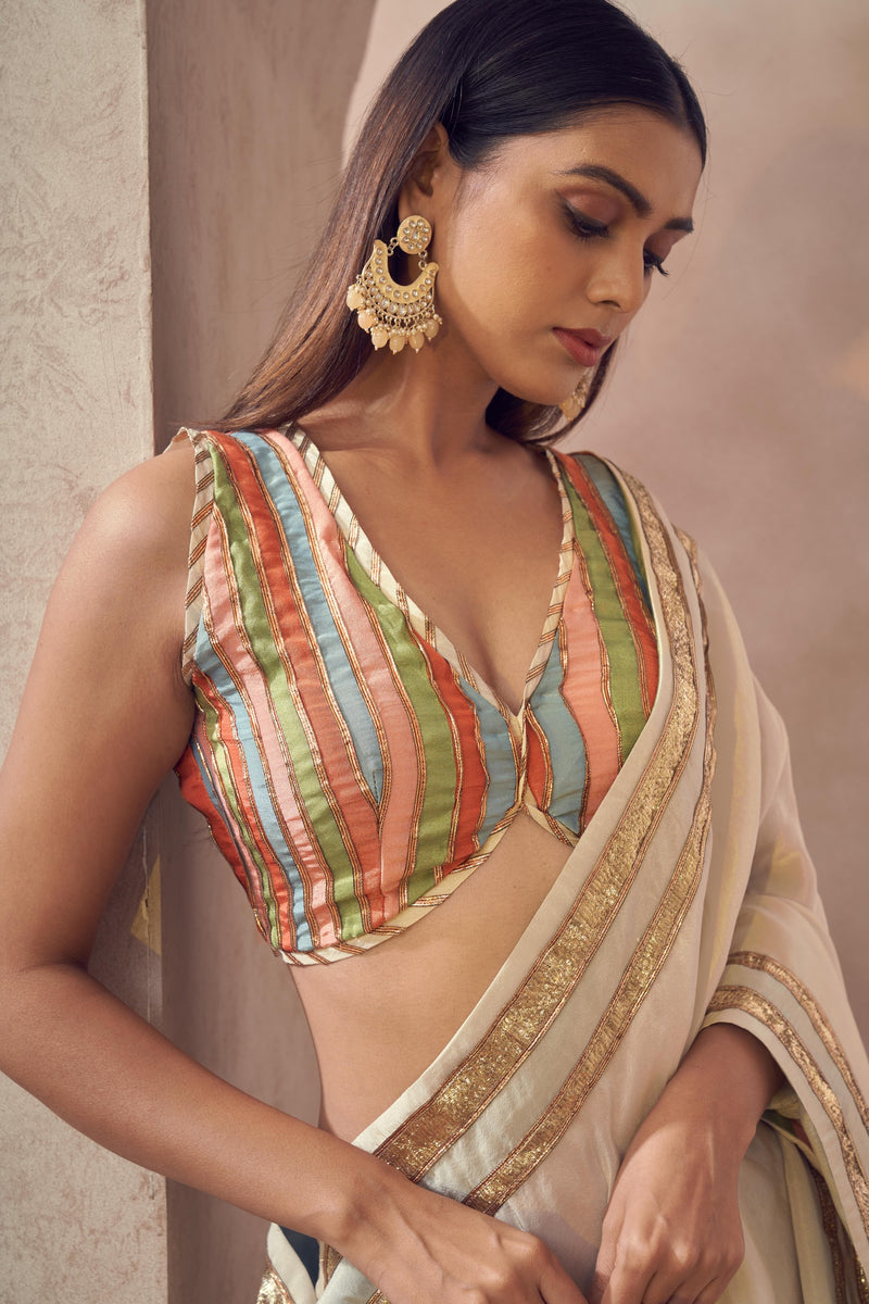 Sunehri Tissue silk saree with multicolored blouse