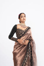 Deep green copper tissue saree set